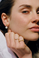 Light pink Aurora ring by PERACAS, showcasing a delicate band with a soft pink gemstone and elegant design.