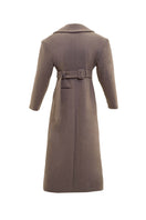Long hazelnut beige coat by Blikvanger, shown on a model, featuring a classic fit with a button-up front and soft fabric.