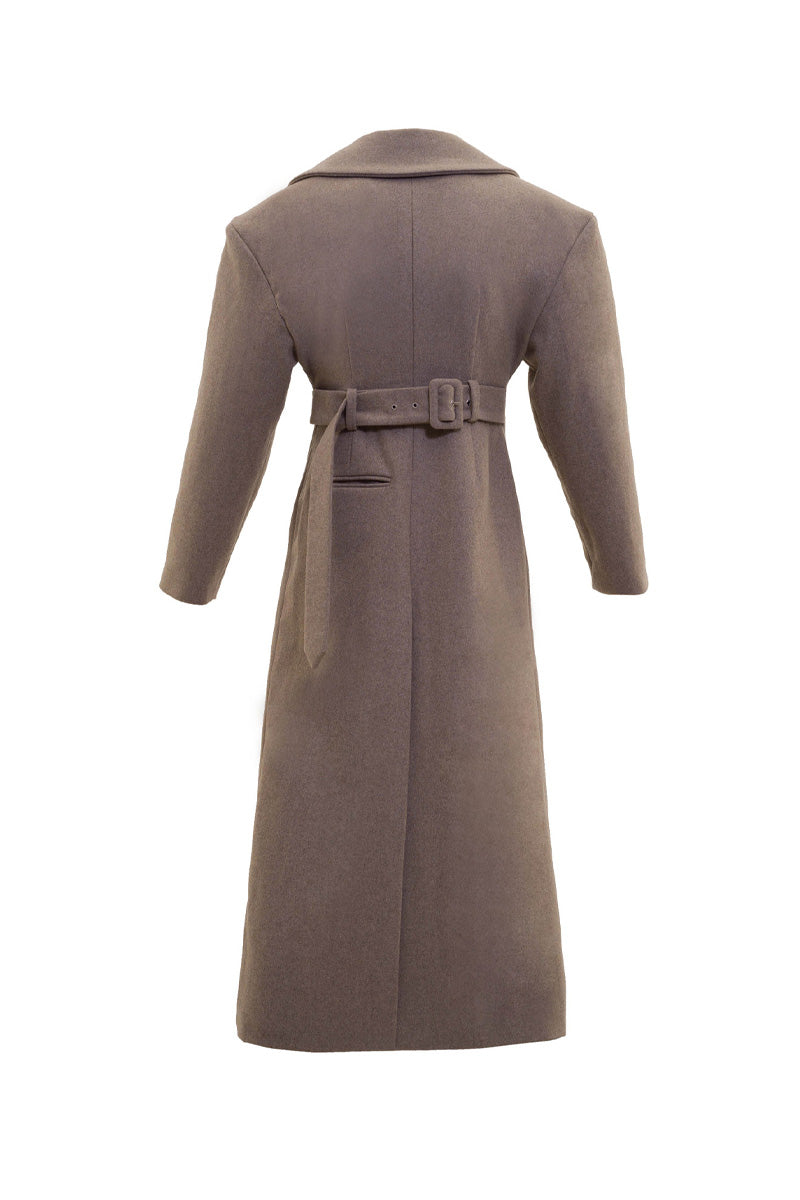 Long hazelnut beige coat by Blikvanger, shown on a model, featuring a classic fit with a button-up front and soft fabric.