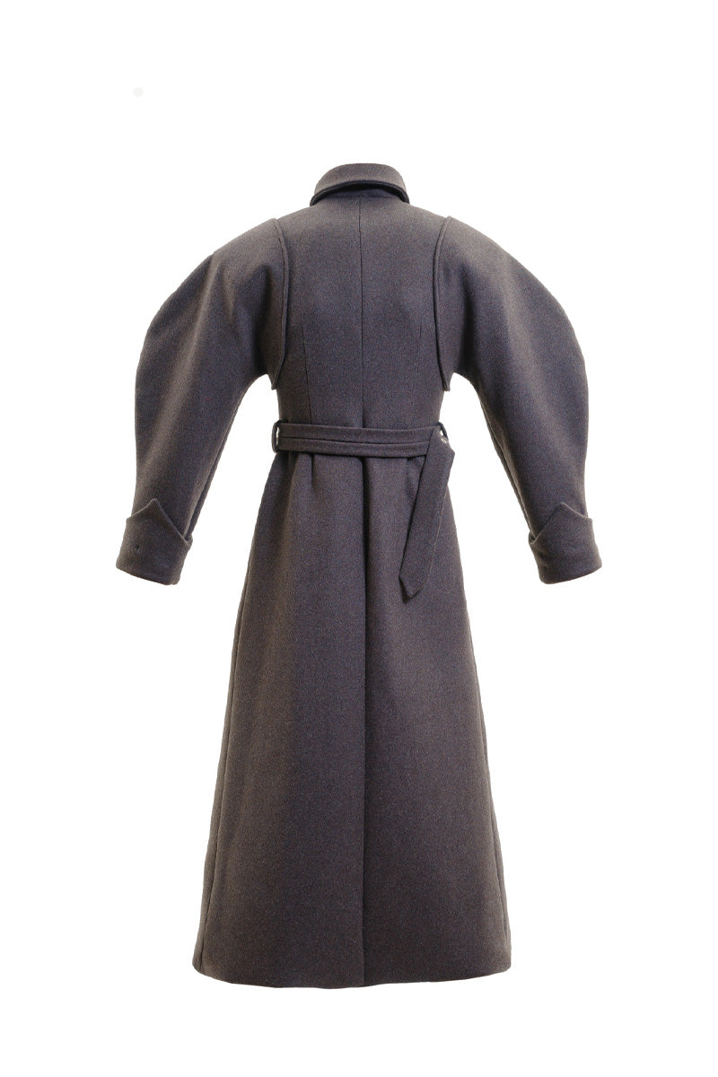 Blikvanger espresso brown puff-sleeved coat displayed on a hanger, showcasing its stylish design and textured fabric.