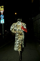 Blikvanger leopard faux fur coat shown on a model, stylish coat with animal print, perfect for cold weather fashion.