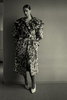 Blikvanger leopard faux fur coat with animal print and plush texture, stylish outerwear for cold weather.