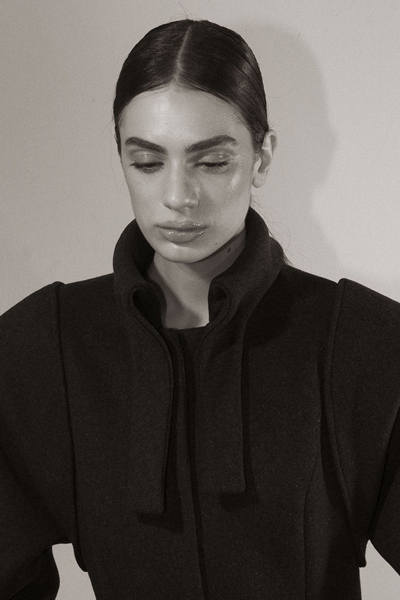 Blikvanger espresso brown puff-sleeved coat with a tailored fit, displayed on a hanger against a neutral background.
