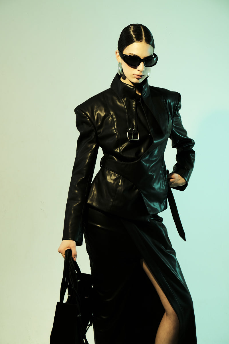 Blikvanger faux leather belt-neck blazer in black, featuring a tailored fit and sleek design, worn on a model.