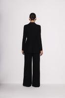 Black Lili Blanc modern elegance blazer shown from the back, tailored with sleek lapels and structured fit.