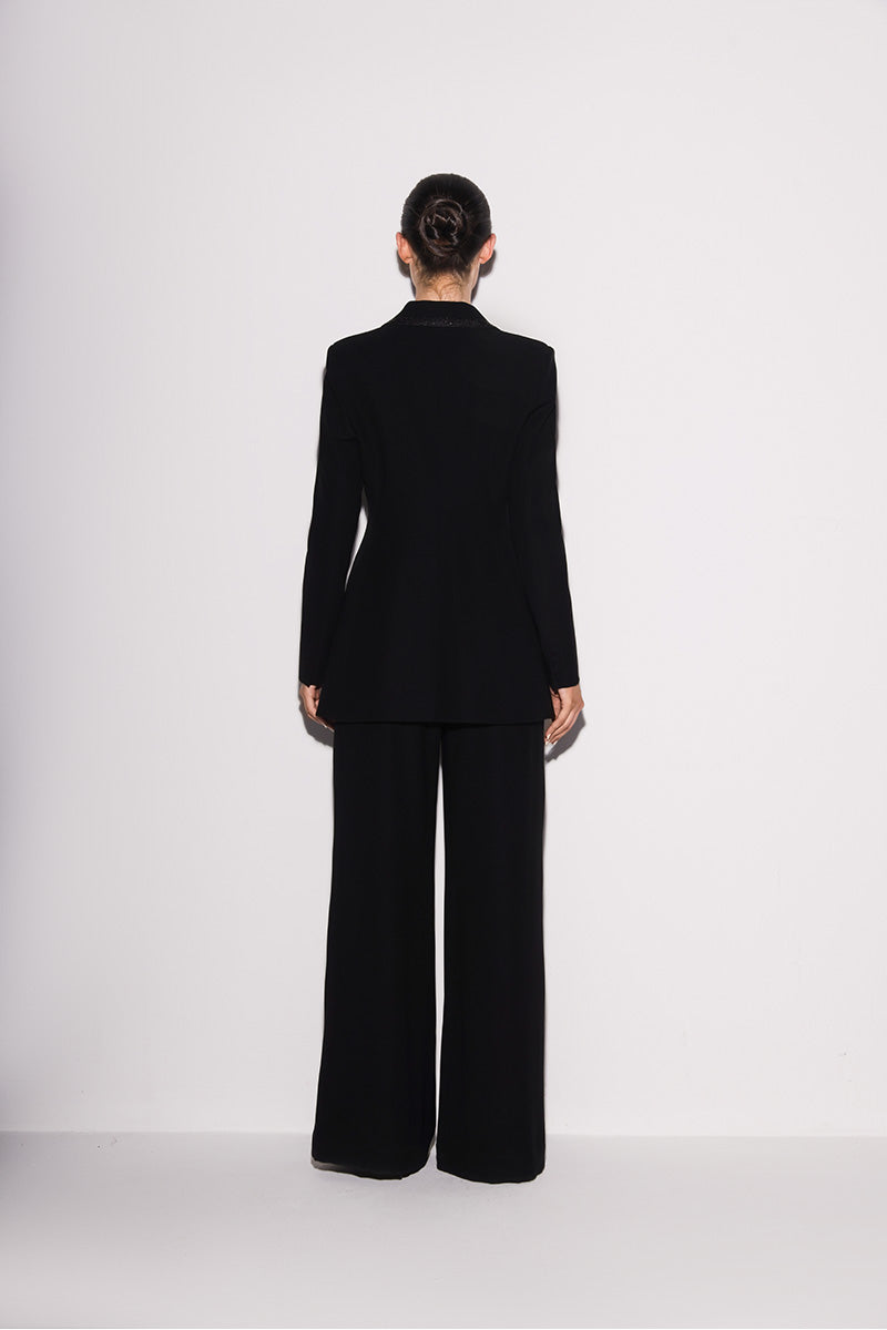 Black Lili Blanc modern elegance blazer shown from the back, tailored with sleek lapels and structured fit.