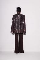 Lili Blanc brown fitted jumpsuit shown from the back, with tailored design and sleek silhouette.