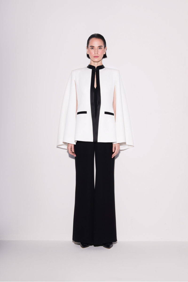 Lili Blanc black and white sleek cape blazer shown from the front, stylish tailored design perfect for formal or professional wear.