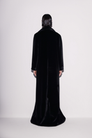 Black vegan fur maxi coat by Lili Blanc, shown from the back, featuring plush texture and long, elegant design.