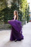 Lili Blanc purple ethereal tulle A-line gown with flowing skirt and delicate bodice, perfect for formal occasions.