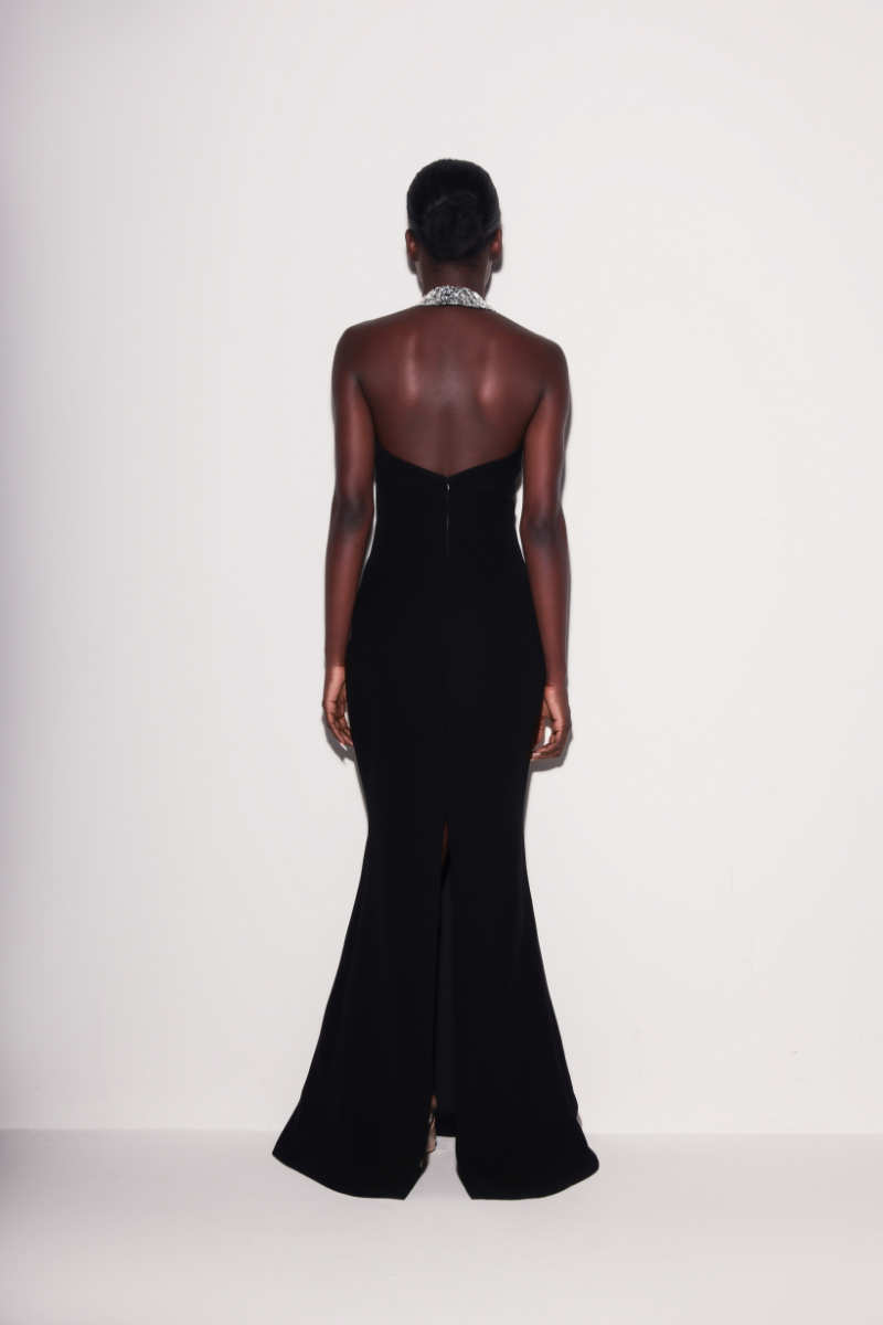 Lili Blanc black refined power gown seen from the back, featuring elegant fabric and tailored design for formal occasions.