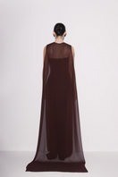Brown Lili Blanc crepe and chiffon caped gown, elegant back view showcasing flowing chiffon cape and fitted crepe bodice.
