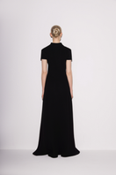 Black Lili Blanc classic knit A-line maxi dress shown from the back, featuring a flowing silhouette and soft knit fabric.