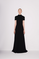 Black classic knit A-line maxi dress by Lili Blanc, front view showing fitted bodice and flowing skirt.