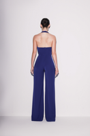 Lili Blanc royal blue V-neck jumpsuit with back view, featuring a fitted waist and wide-leg pants.