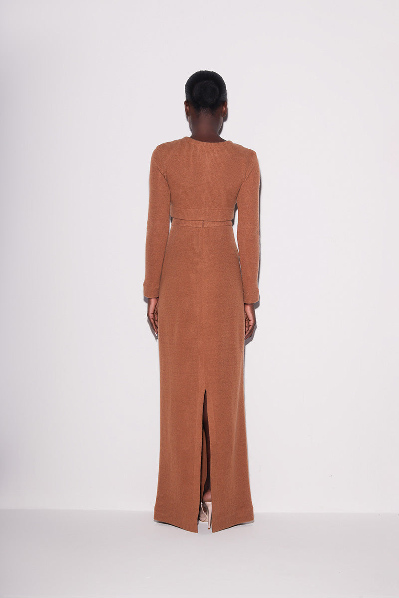 Back view of Lili Blanc elegant knit crop top in brown, showcasing its fitted design and soft knitted texture.