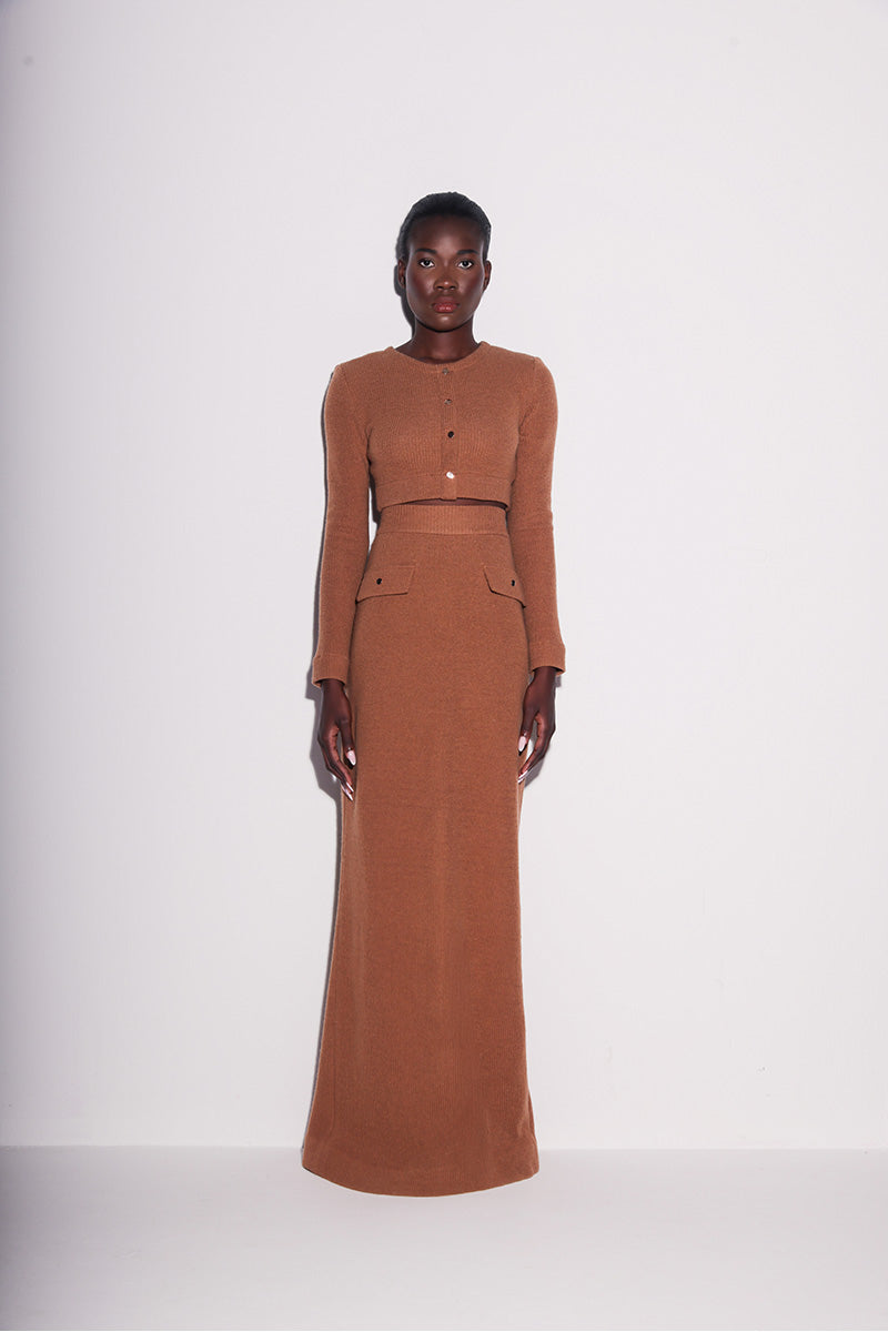 Brown knit crop top by Lili Blanc, stylish front view showcasing its elegant design and fitted silhouette.