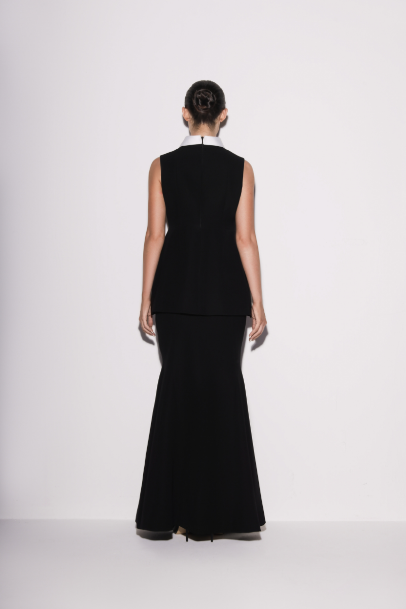 Black crepe mermaid maxi skirt by Lili Blanc, shown from the back, featuring a fitted silhouette and elegant design.