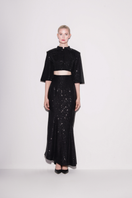 Black sequin cropped top by Lili Blanc featuring radiant sparkle and fitted design, perfect for stylish evening wear.