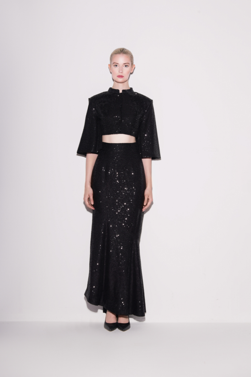 Black sequin cropped top by Lili Blanc featuring radiant sparkle and fitted design, perfect for stylish evening wear.