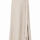 Lili Blanc cashmere wrap maxi skirt in a soft, neutral color, shown from the front with elegant draping and a comfortable fit.
