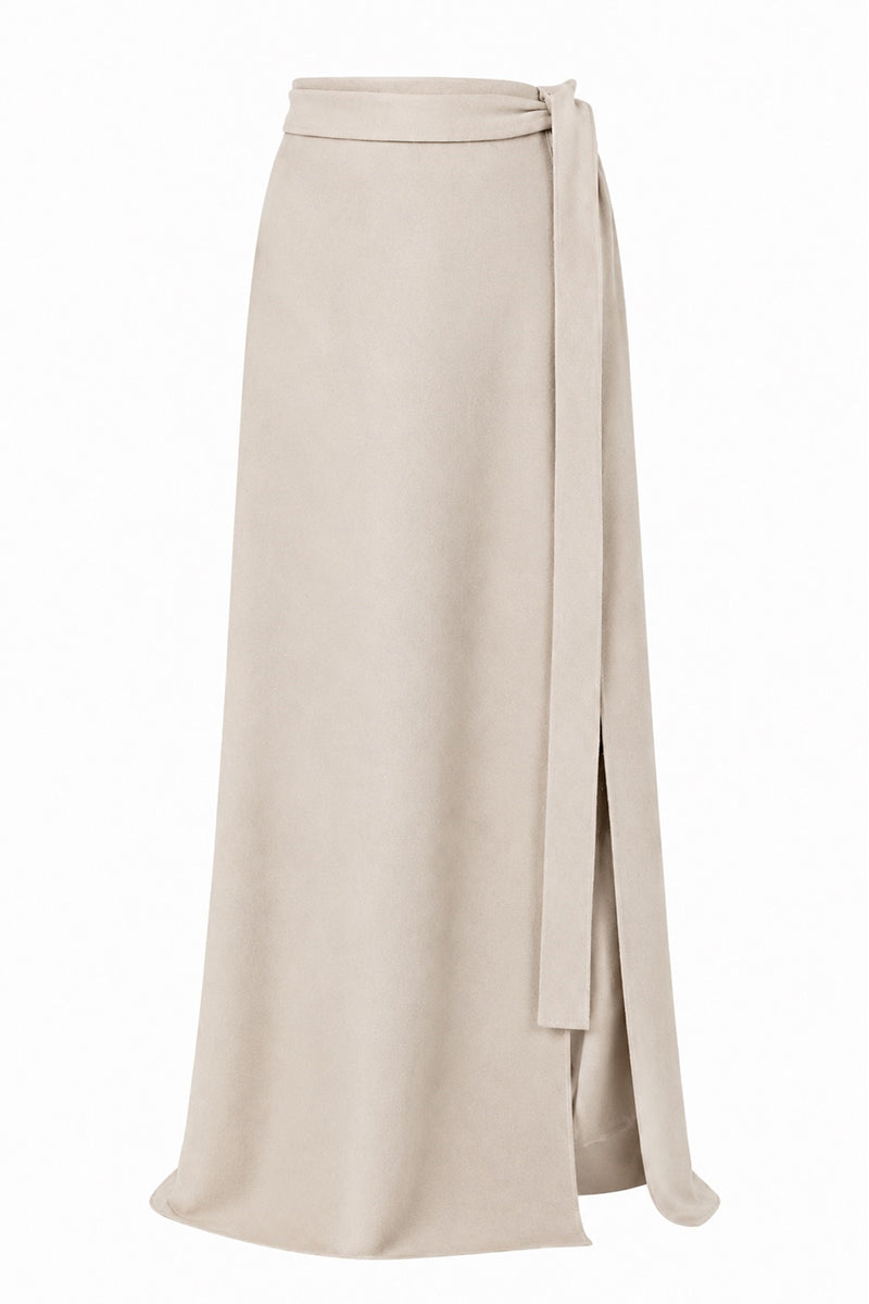 Lili Blanc cashmere wrap maxi skirt in a soft, neutral color, shown from the front with elegant draping and a comfortable fit.