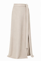 Lili Blanc cashmere wrap maxi skirt in a soft, neutral color, shown from the front with elegant draping and a comfortable fit.
