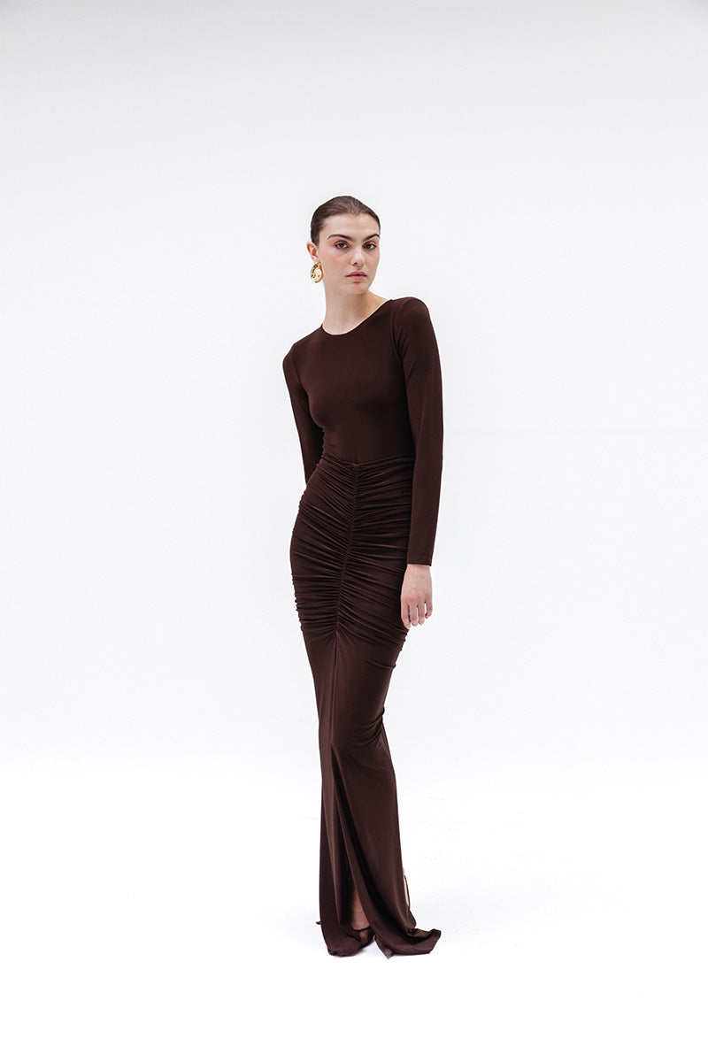 Studio NK Azalea brown bodysuit, a stylish and fitted top with long sleeves and scoop neckline, displayed on a mannequin.