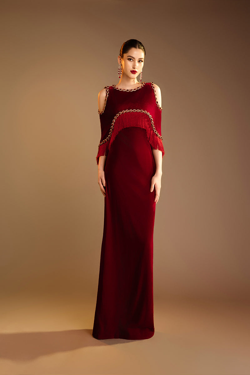 Red Valenciani shoulder cutouts cape gown, elegant formal dress with flowing fabric and stylish shoulder design.