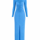 Maylé Vásquez Aborigen maxi dress in ice blue, flowing fabric with intricate patterns, styled for elegant summer wear.