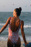 Verdelimon Acacia reversible one-piece swimsuit in black and white poppy print, shown on a model with a flattering fit.