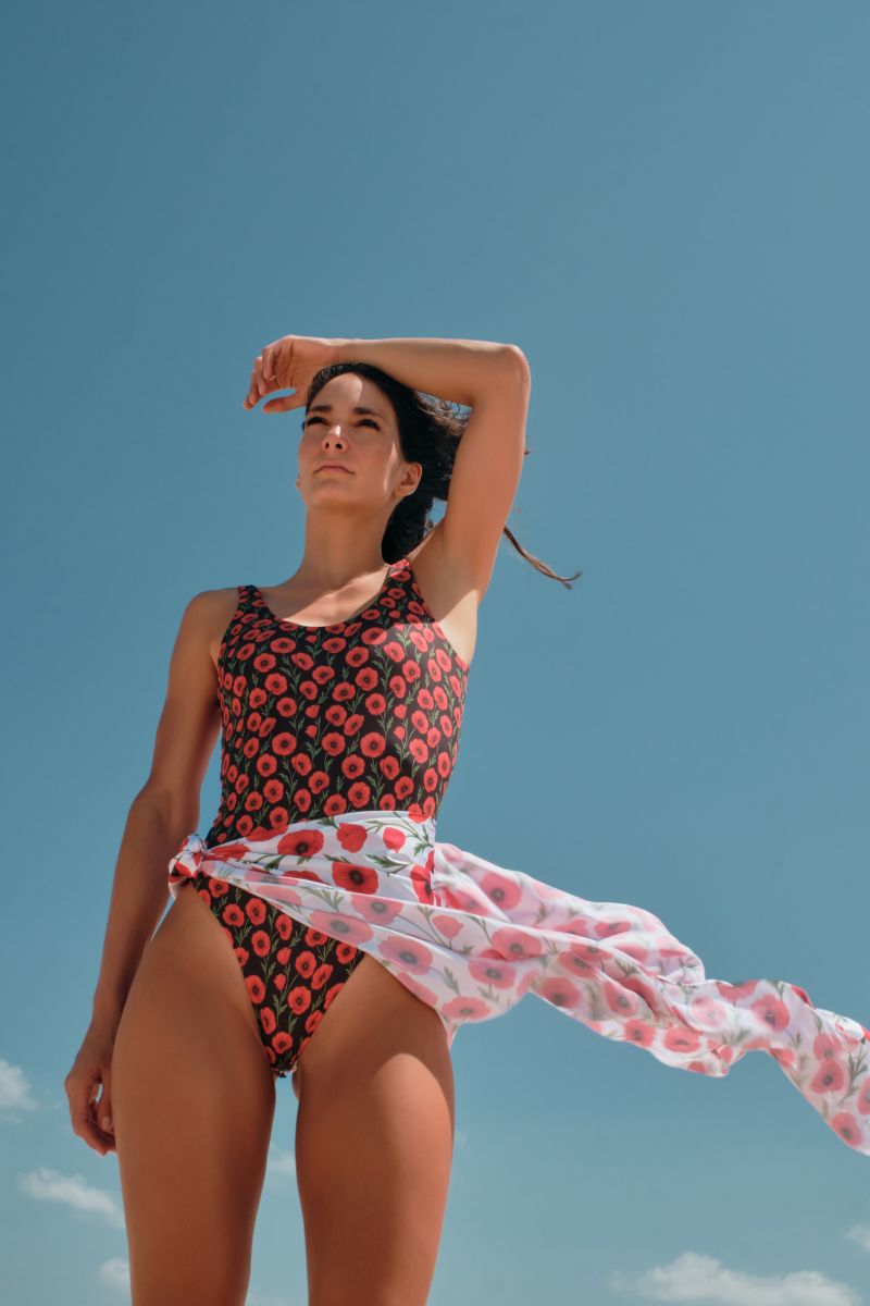 Reversible Verdelimon Acacia one-piece swimsuit in black and white poppy print, featuring a stylish, fitted design for women.