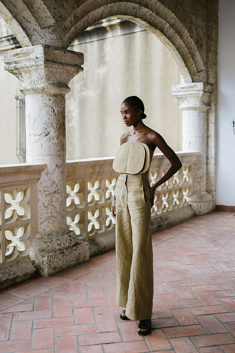 ANA + MARIA Acar Pants in Apple Cinnamon color, featuring a relaxed fit with waistband and pocket details, shown on a model.