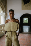 ANA + MARIA Acar Pants in Apple Cinnamon shown in a natural pose, featuring a relaxed fit and stylish design in warm cinnamon color.