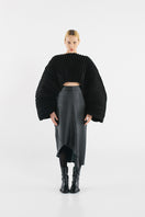 Black accordion snail sweater by MAZ Manuela Álvarez featuring a textured, ribbed design and cozy knit fabric.
