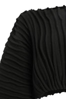 Black accordion snail sweater by MAZ Manuela Álvarez, featuring a textured, layered design and cozy knitted fabric.
