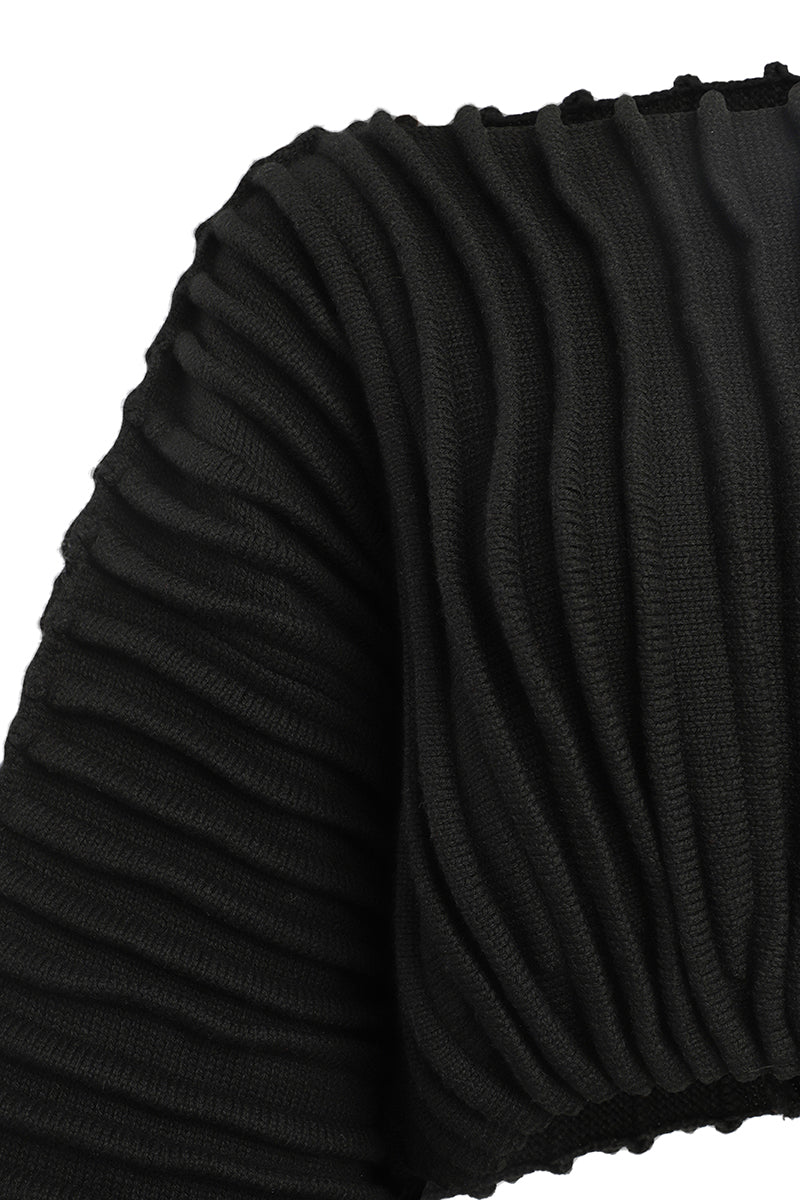 Black accordion snail sweater by MAZ Manuela Álvarez, featuring a textured, layered design and cozy knitted fabric.