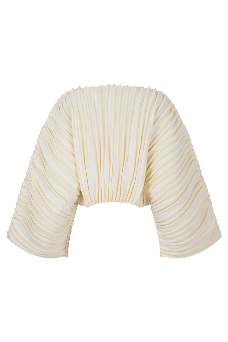 Ivory accordion snail sweater by MAZ Manuela Álvarez featuring textured, ribbed knit pattern and long sleeves.