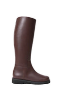 A pair of AERA ADA brown nappa leather boots with a sleek design and ankle-high style, featuring rounded toes and sturdy soles.