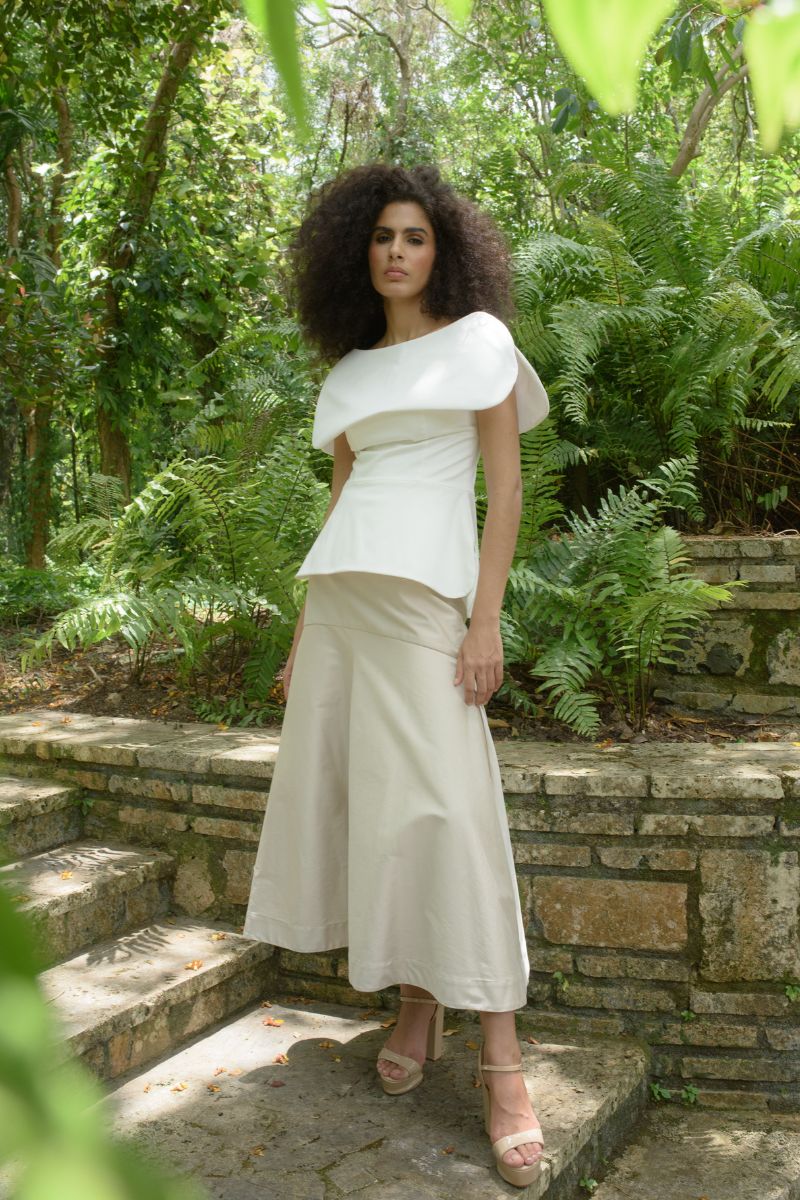 ANA + MARIA ADA Sand midi skirt in ivory, featuring a flowy design and elegant silhouette.