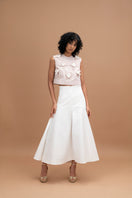 Elegant ivory midi skirt by ANA + MARIA, showcasing a flowing design with a high waist and soft fabric.