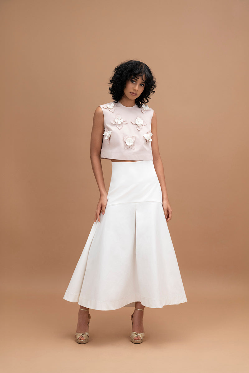 Elegant ivory midi skirt by ANA + MARIA, showcasing a flowing design with a high waist and soft fabric.