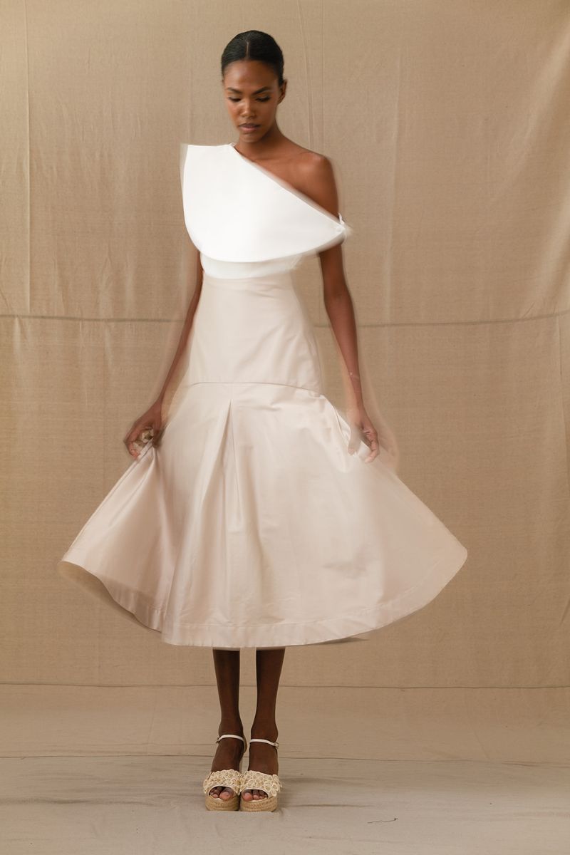 ANA + MARIA ADA Sand midi skirt in ivory, featuring a flowing fabric and stylish design, perfect for casual or dressy occasions.