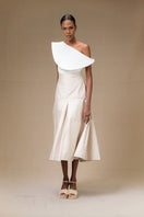 ANA + MARIA ADA sand-colored midi skirt in soft fabric, shown on a model with a flowing, elegant design.