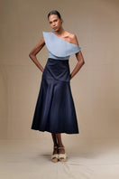 Navy blue Midi skirt from ANA + MARIA's ADA collection, featuring a flowing fabric and elegant design.