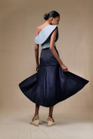Navy blue Ana + Maria midi skirt with a flowing silhouette, styled for a casual or office look, shown in a front view.