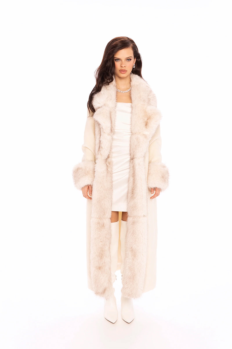 Nana Jacqueline Adriana faux fur coat in off-white, stylish and cozy coat displayed on a model in a lookbook setting.