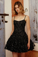 Gigii's Karolin Dress mini dress featuring a stylish design, shown in the image with a flattering fit and vibrant fabric.