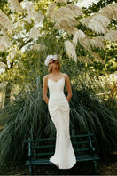 Elegant ETERNA GOWN by Gigii's featuring flowing fabric and intricate detailing, perfect for formal occasions.