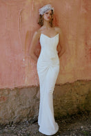 Elegant ETERNA gown by Gigii's featuring flowing fabric and intricate detailing, perfect for formal occasions.